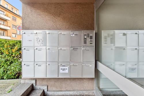 a group of lockers on the side of a building at Beautiful Boutique Apartment DRAHTZUG8 in Zürich