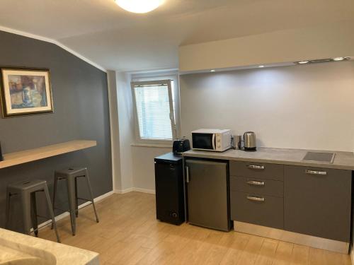 Η κουζίνα ή μικρή κουζίνα στο la suite di via Mazzini