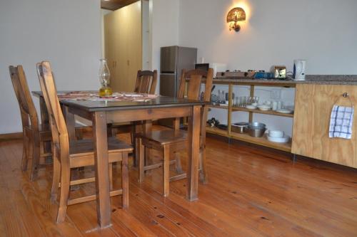 a kitchen with a table and chairs in a room at The Farmers Lodge in Thorndale