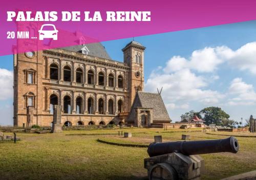 a large building with a cannon in front of it at Joyau secret # Jardin # Piscine # Bien-être # prox centre ville in Antananarivo
