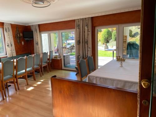 a dining room with a table and some chairs at Landhaus Töchterle in Telfes im Stubai