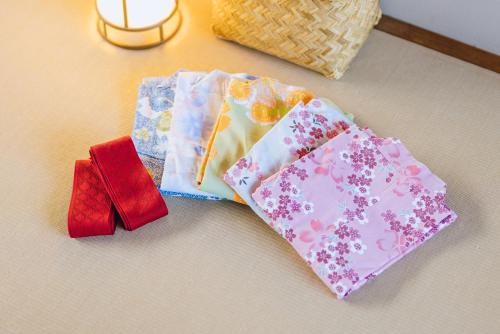 three ties sitting on top of a table at SEKIYA RESORT Terrace Midoubaru in Beppu