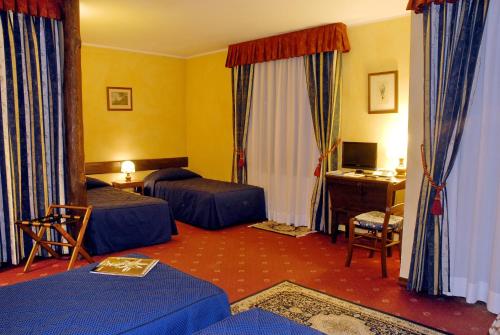 Postel nebo postele na pokoji v ubytování Hotel Edelweiss & SPA