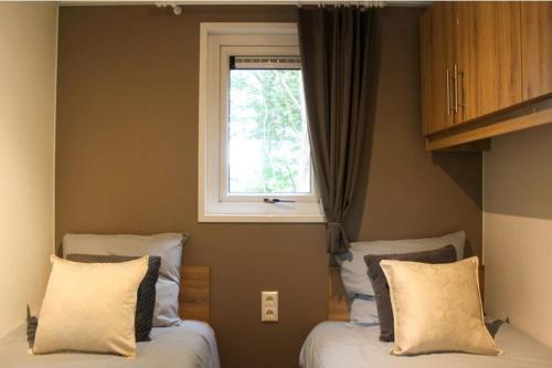 Postel nebo postele na pokoji v ubytování Vakantiehuis Fochteloërveen