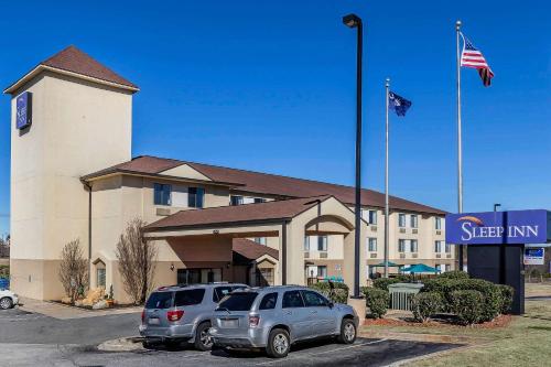 two cars parked in a parking lot in front of a hotel at Sleep Inn Gaffney at I-85 in Gaffney