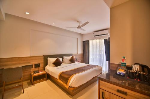 Postel nebo postele na pokoji v ubytování Regenta Inn Palacio De Goa, Panjim