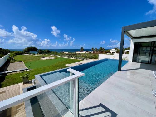a view of a swimming pool from a house at Luxury Villa Beach and Putt avec accès plage in Saint-François