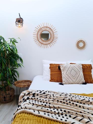 a bedroom with a bed and a mirror on the wall at CASINHA DE FERRAGUDO - Terraço Privado, AC, WiFi, Centro 250m in Ferragudo