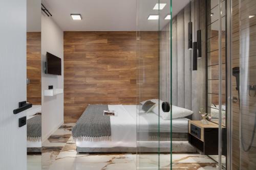 a bathroom with a tub and a glass shower at Villa SPA DECK 1, DECK 2, DECK 3 in Dramalj