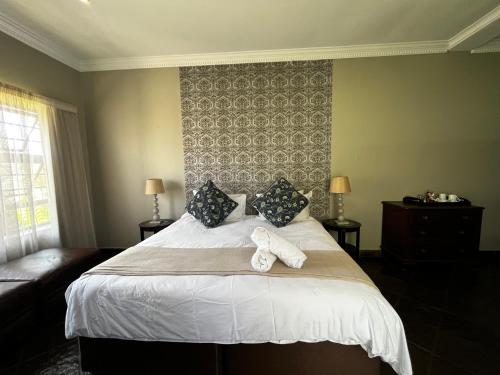 Кровать или кровати в номере House Haven Guesthouse