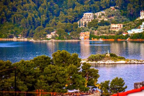 a small island in the middle of a lake at La Maison Plakes Rooftop Apt in Skiathos
