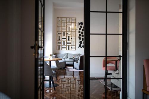 a dining room with a table and chairs at Jump INN Hotel Belgrade in Belgrade