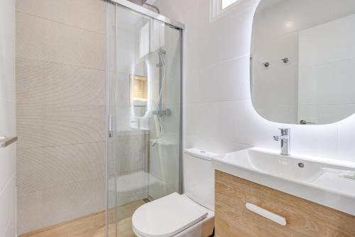 a bathroom with a shower and a toilet and a sink at Sea sand and sun in Callao Salvaje