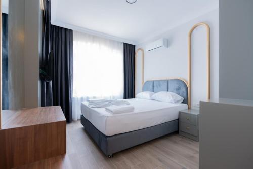 Ein Bett oder Betten in einem Zimmer der Unterkunft Gurses Life Hotel