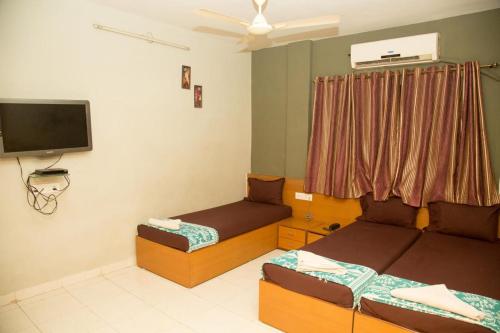 A seating area at Srujan Sarai Service Apartment