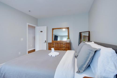a bedroom with a white bed and a mirror at Boston Queen Bedroom in Boston