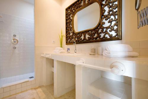 a bathroom with a sink and a mirror at Villa 87 in Corralejo