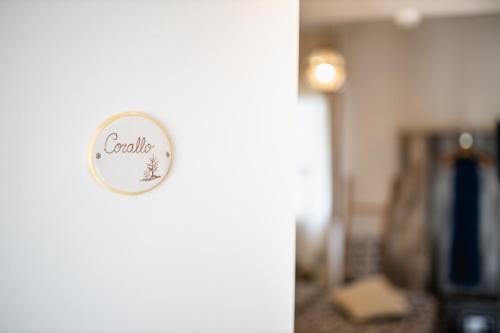 a door with a sign that says candy on it at Love & Fama Hotel in Sabaudia