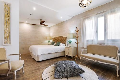 En eller flere senge i et værelse på Villa del Relax