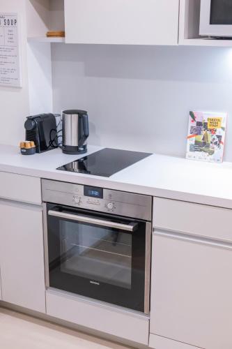 a kitchen with a stove top oven in a kitchen at Luxury Suites Liechtenstein in Vienna