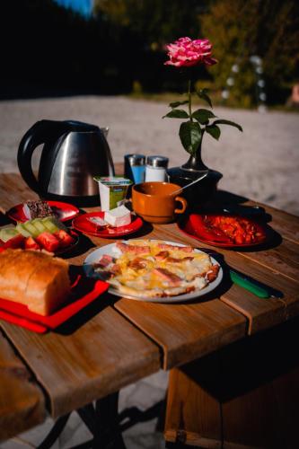 a table with plates of food on top of it at Village Jazz in Chimankend