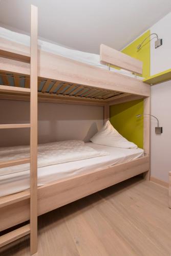 Ένα ή περισσότερα κρεβάτια σε δωμάτιο στο Familotel Alphotel