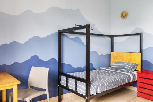 Postel nebo postele na pokoji v ubytování Bushpig Backpacker Hostel