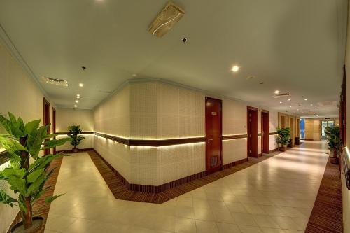 a hallway of a building with a hallway at Al Manar Grand Hotel Apartment in Dubai