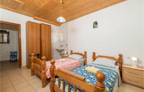 Ένα ή περισσότερα κρεβάτια σε δωμάτιο στο Amazing Home In Susak With Kitchen