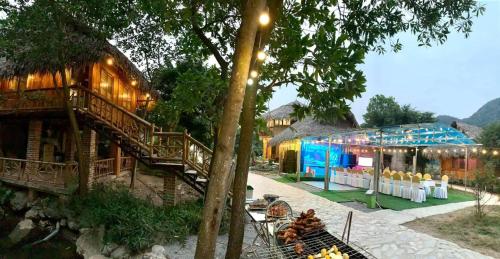 a resort with a staircase and a building with a tent at Hang Lan Bungalow in Ninh Binh
