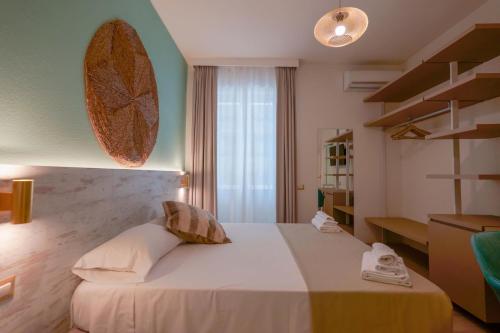 Un ou plusieurs lits dans un hébergement de l'établissement Hotel Maison del Sole