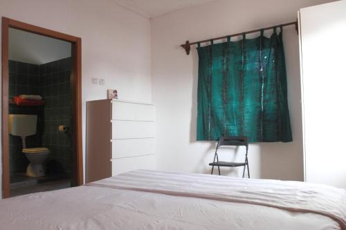 Кровать или кровати в номере Sanchaba Yellow Apartments