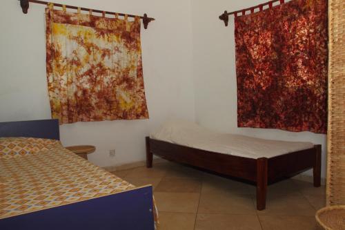 Кровать или кровати в номере Sanchaba Yellow Apartments