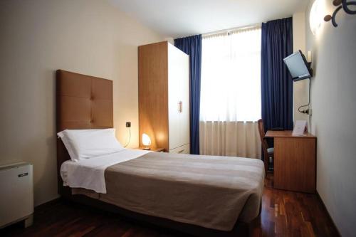 Ein Bett oder Betten in einem Zimmer der Unterkunft Sole della Franciacorta - Hotel & Restaurant