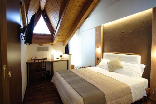 Postel nebo postele na pokoji v ubytování Sole della Franciacorta - Hotel & Restaurant