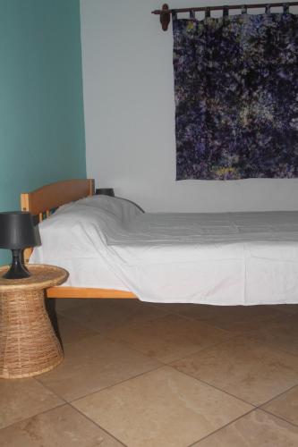 Кровать или кровати в номере Sanchaba Yellow Apartments