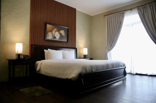 En eller flere senge i et værelse på Los Mandarinos Boutique Hotel & Spa