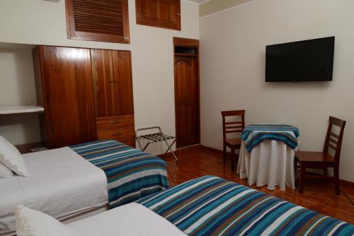 Postel nebo postele na pokoji v ubytování Casablanca Hotel