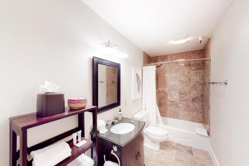 a bathroom with a sink and a toilet and a shower at Ketchum Getaways in Ketchum
