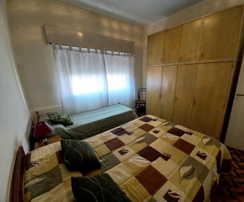 Una cama o camas en una habitación de El Ceibo