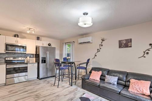 a living room with a couch and a table with chairs at Ideally Located West Palm Beach Apartment! in West Palm Beach