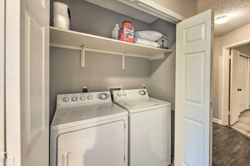 a small laundry room with a washer and dryer at Gorgeous Austin Getaway with Fire Pit about 8 Mi to Dtwn in Austin