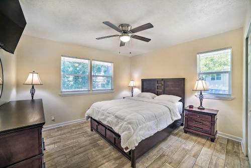 a bedroom with a bed and a ceiling fan at Charming Tallahassee Home 1 Mi to Lake Ella! in Tallahassee