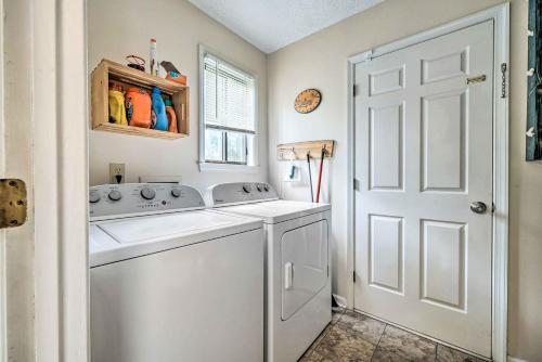a white laundry room with a washer and dryer at Pet-Friendly Wilmington Home with Fenced Yard! in Wilmington