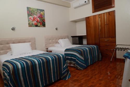 Postel nebo postele na pokoji v ubytování Casablanca Hotel