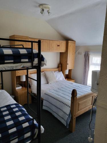 A bed or beds in a room at Talbot House