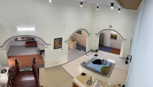 an overhead view of a living room with archways at Family’s gardem 