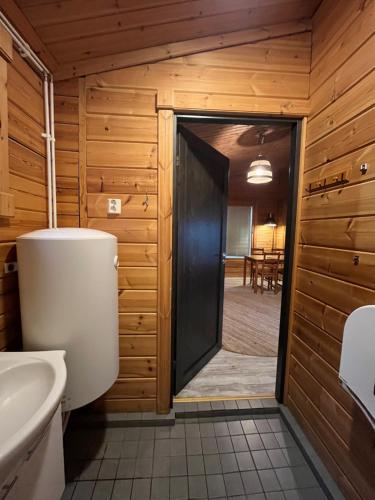 a bathroom with a toilet and a sink at Cottage by the sea in Hanko