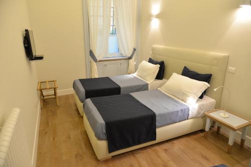 Кровать или кровати в номере Little Rose Residence