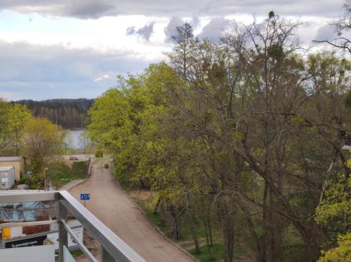 a view from a balcony of a road with trees at Apartament Parkowa in Olecko
